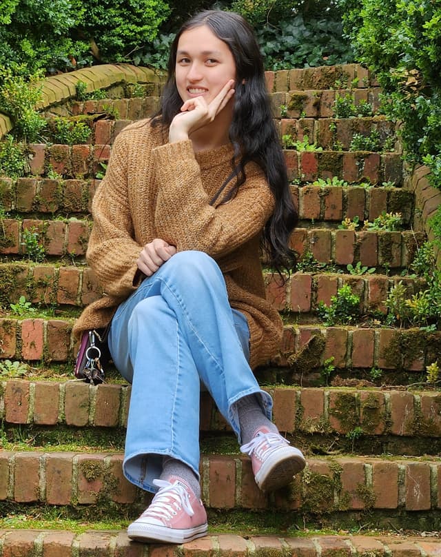 A picture of me sitting cross-legged on stairs